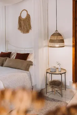 a bedroom with a bed and a side table at Anerada Cottages in Apsiou