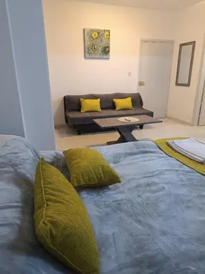 a living room with two beds and a couch at Sea-side City centre Studio in Larnaka