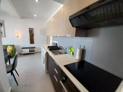 a kitchen with a sink and a counter top at Coco De Mer 408 in Limassol