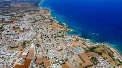 an aerial view of a city next to the ocean at Alex Villa Kapparis in Protaras