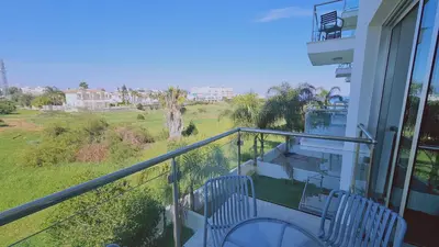 a balcony with a view of a field at STAY White Coral Studio in Protaras