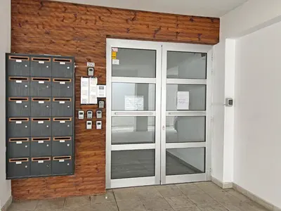 a wall with lockers and a door in a room at Albert's Apartment Center 202B in Larnaka