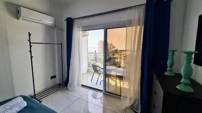 a room with a window with a view of a balcony at 351 Turquoise Oasis in Limassol