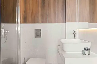 a bathroom with a toilet and a sink and a shower at Phaedrus Living: Limassol Seaside Residences 01 in Limassol