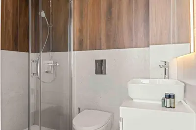 a bathroom with a shower and a toilet and a sink at Phaedrus Living: Limassol Seaside Residences 01 in Limassol