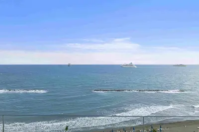 two ships in the ocean on a sunny day at Phaedrus Living: Limassol Seaside Residences 01 in Limassol