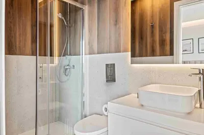 a bathroom with a shower and a toilet and a sink at Phaedrus Living: Limassol Seaside Residences 02 in Limassol