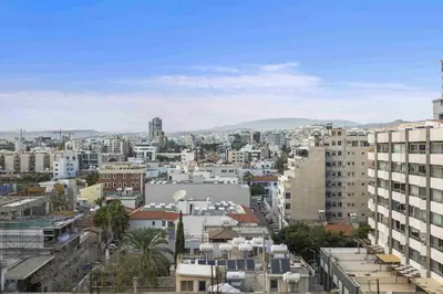 a city view of a city with buildings at Phaedrus Living Limassol Seaside Residences 06 in Limassol