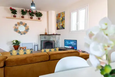 a living room with a couch and a fireplace at Hubstay Hillside Residence with Private Jacuzzi in Platres