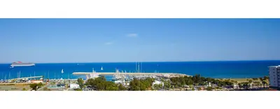a view of a marina with a ship in the water at Aphrodite Heights in Larnaka