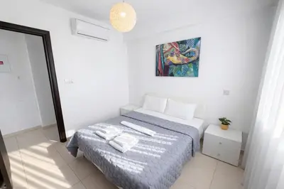 a bedroom with a bed with two towels on it at Villa Dolce Vita in Protaras