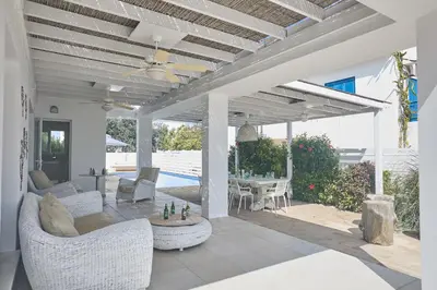 a patio with couches and a table and a ceiling at Protaras Serifos Villa Sv07 in Paralimni