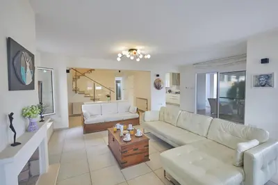 a living room with a couch and a table at Protaras Serifos Villa Sv07 in Paralimni