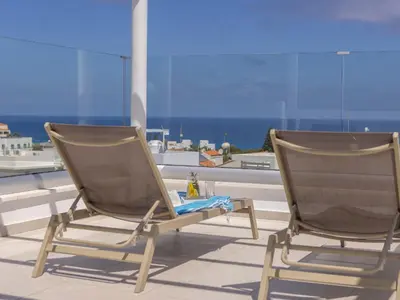 two chairs on a balcony with a view of the ocean at Villa Natalie-Mylos H24 in Protaras