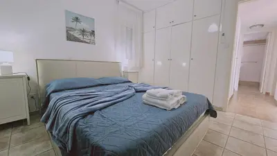 a bedroom with a bed with towels on it at STAY Princess Villa in Protaras