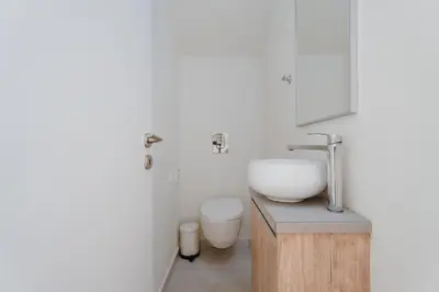 a bathroom with a sink and a toilet at NEW 2BR Townhouse in Luxury Resort Pool & Beach in Protaras