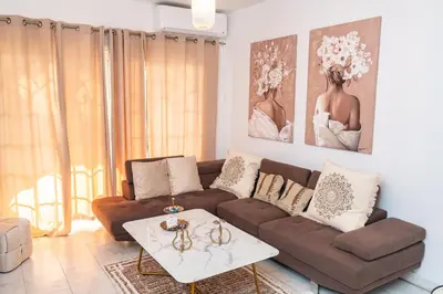 a living room with a couch and a table at Quattro City Center Apartments in Larnaka