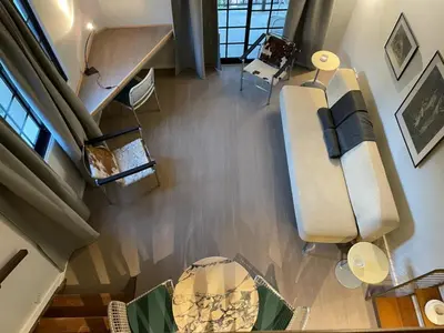 an overhead view of a living room with a couch and chairs at Calming Mountain View Apt with Balcony & Free Parking near Kakopetria in Nicosia