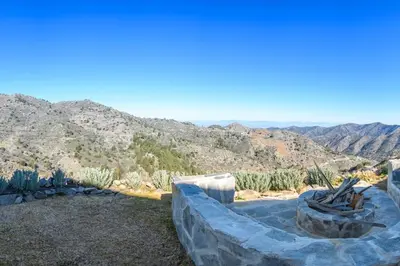 a view of a desert with mountains in the background at Serenity Mountain in Askas