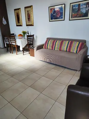 a living room with a couch and a table at Mariam Apartment in Larnaka