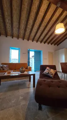 a living room with a couch and a table at GPPh in Pelendri