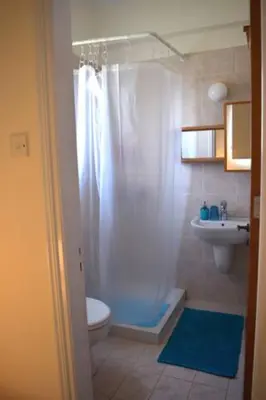a bathroom with a shower and a toilet and a sink at Villa Calm 100m from the beach in Ayia Napa