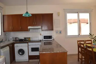 a kitchen with a sink and a stove top oven at Villa Calm 100m from the beach in Ayia Napa