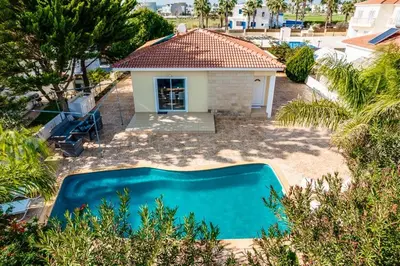 an overhead view of a swimming pool in front of a house at Sunrise Experience in Ayia Napa