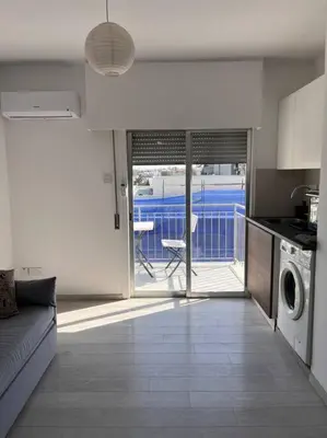 a kitchen with a washer and dryer in a room at Top floor Flat in Nicosia 2 in Nicosia
