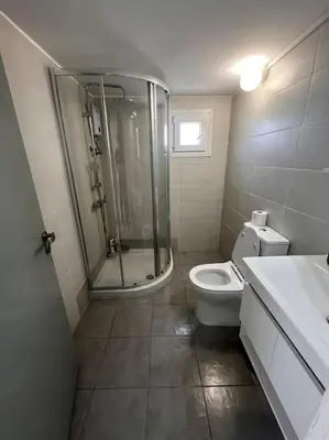a bathroom with a shower and a toilet and a sink at Top floor Flat in Nicosia 2 in Nicosia