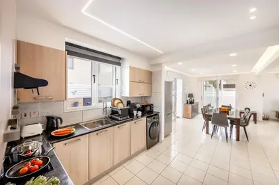 a kitchen with a sink and a counter top at The Second Diamond Protara - 2' Walk to Beach in Protaras