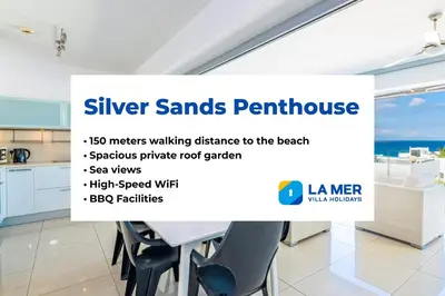 a table in a kitchen with a sign that reads silver sands furniture metres walking at Silver Sands Penthouse in Protaras