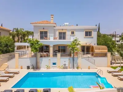 a large house with a swimming pool in front of it at Luxury Seaview Limassol Villa Pool Jacuzzi Sauna in Limassol