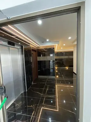 a glass door in a room with a tiled floor at Le Voyageur II in Larnaka