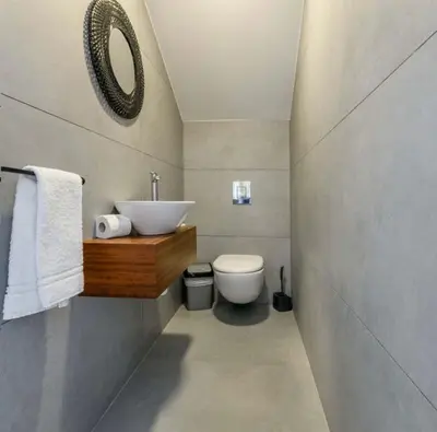 a bathroom with a sink and a toilet at By the beach Villa 2 in Protaras