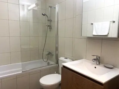 a bathroom with a toilet and a sink and a shower at DPSAE09 Mythical Sands Resort - Two Bedroom Apt with pool in Paralimni