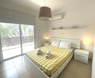 a bedroom with a bed with two teddy bears on it at DPSAE09 Mythical Sands Resort - Two Bedroom Apt with pool in Paralimni