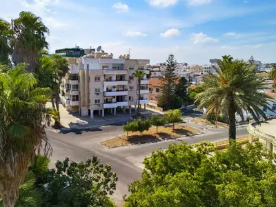 an aerial view of a street with palm trees at Large apartment close to Finikoudes Beach with 2 balconies in Larnaka