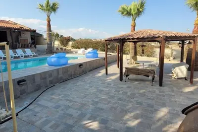 a patio with a gazebo and a swimming pool at Despol Villa in Alaminos