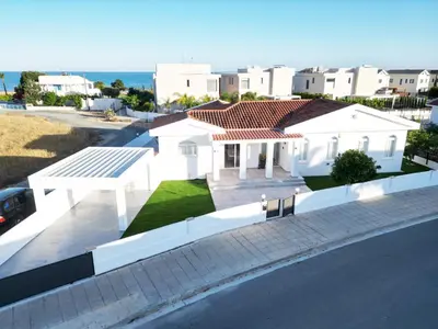 a white house with a view of the ocean at Villa Aquamarine in Ayia Napa