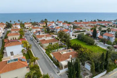 an aerial view of a residential neighborhood next to the ocean at Villa with private pool in Pervolia, Larnaca in Pervolia