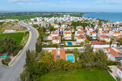 an aerial view of a city with houses and a road at Villa with private pool in Pervolia, Larnaca in Pervolia