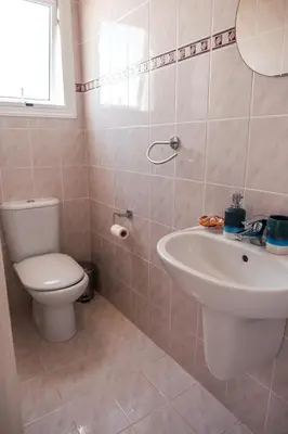 a bathroom with a toilet and a sink at Mermaid Villa 16 in Ayia Napa