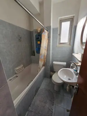 a bathroom with a tub and a toilet and a sink at Beautiful Apartment in Center of Nicosia with views in Nicosia