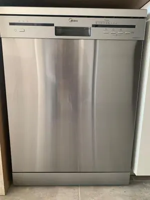 a stainless steel dishwasher sitting in a kitchen at Antonia Sea View Suite in Larnaka