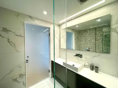 a bathroom with a sink and a mirror at Penthouse Luxury Apartment in Nicosia