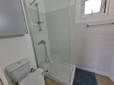 a bathroom with a shower and a toilet at Kitieos Central Apts 100m from Finikoudes Beach in Larnaka