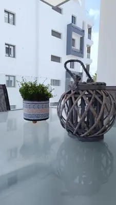 two plants sitting on a table in a building at Larvella Estia Luxury Suites in Larnaka
