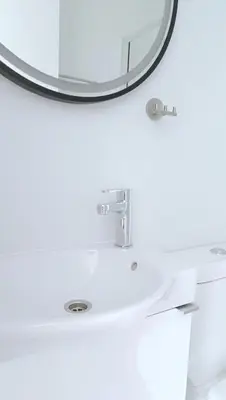 a bathroom with a sink and a mirror at Larvella Estia Luxury Suites in Larnaka
