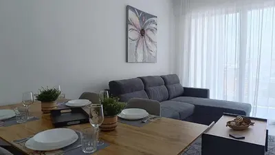 a living room with a table and a couch at Larvella Estia Luxury Suites in Larnaka